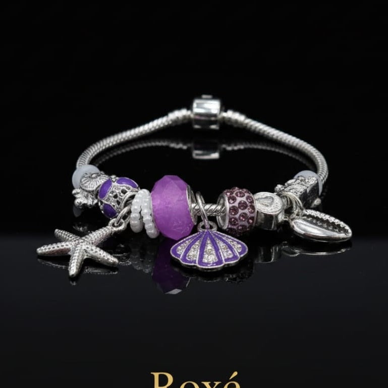 Bratara dama ROXE argintie cu charmuri marine si pandantive elegante, model chic