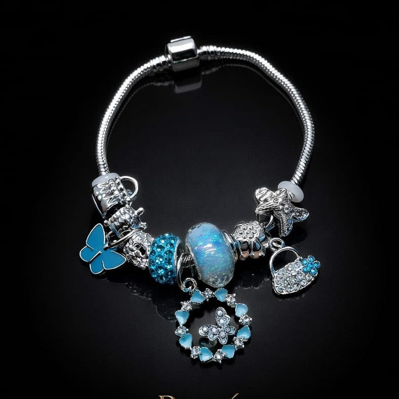 Bratara ROXE argintie cu fluture si posetuta charmuri elegante dama