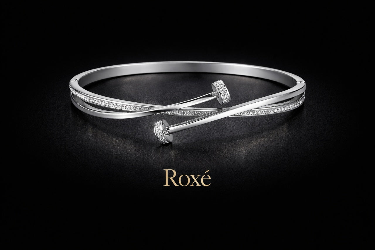 Bratara ROXE argintie eleganta cu design incrucisat si cristale inchizatoare fixa