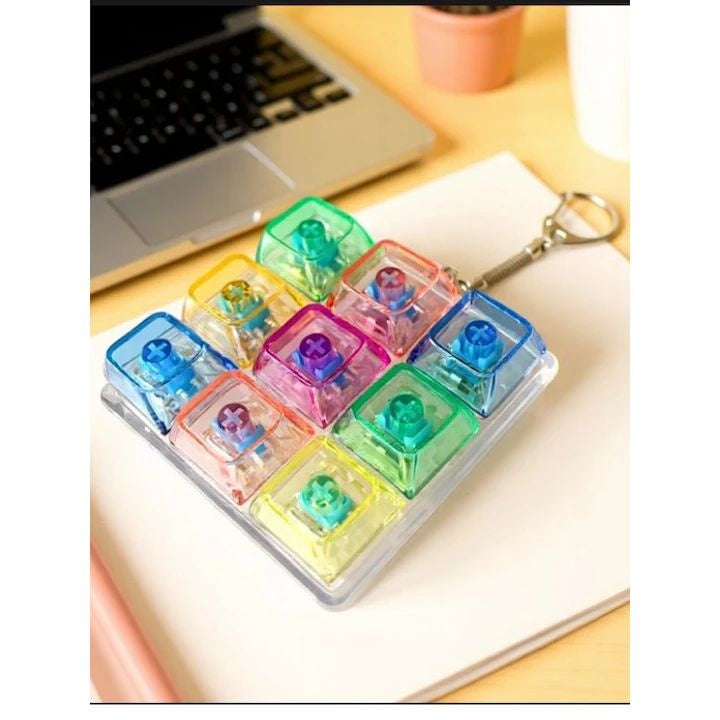 Jucărie Breloc Antistres Tastatură 9 Taste cu Lumini LED | Mini Fidget Luminos pentru Relaxare