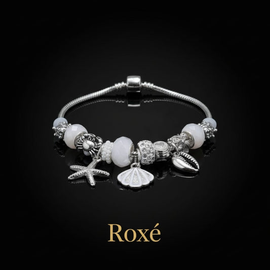 Bratara dama ROXE argintie cu charmuri marine si pandantive elegante, model chic