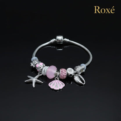 Bratara dama ROXE argintie cu charmuri marine si pandantive elegante, model chic