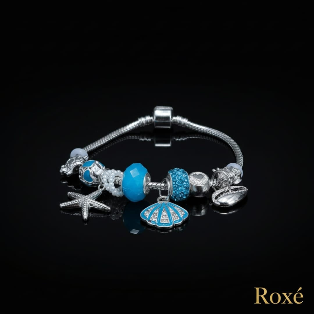 Bratara dama ROXE argintie cu charmuri marine si pandantive elegante, model chic