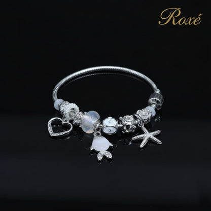 Bratara dama ROXE argintie cu charmuri pestisor si steluta, model elegant modern