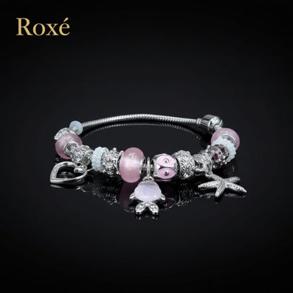 Bratara dama ROXE argintie cu charmuri pestisor si steluta, model elegant modern
