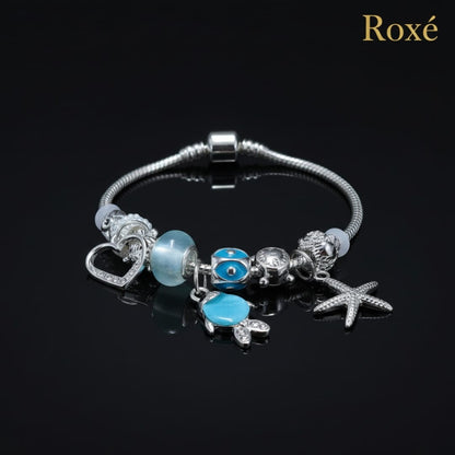 Bratara dama ROXE argintie cu charmuri pestisor si steluta, model elegant modern