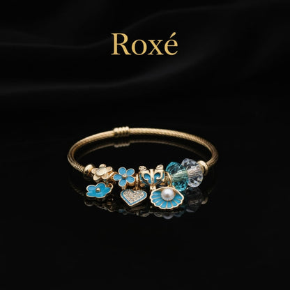 Bratara dama ROXE aurie cu charmuri flori si scoica, model elegant cu cristale