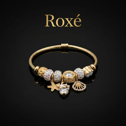 Bratara dama ROXE aurie cu charmuri marine si cristale, model elegant fashion