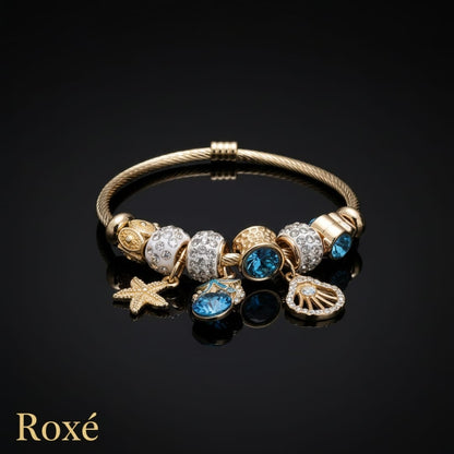 Bratara dama ROXE aurie cu charmuri marine si cristale, model elegant fashion