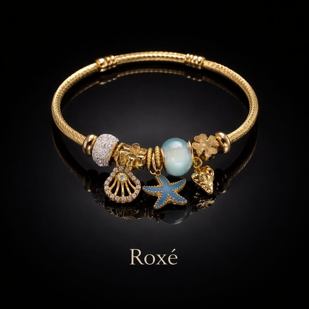 Bratara dama ROXE aurie cu charmuri marine stea de mare si scoica, eleganta