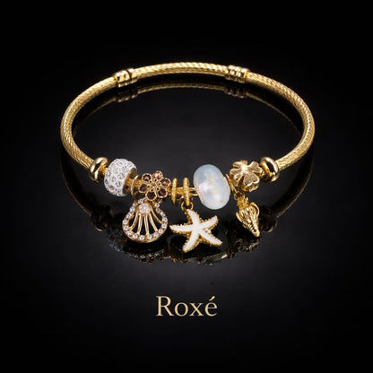 Bratara dama ROXE aurie cu charmuri marine stea de mare si scoica, eleganta