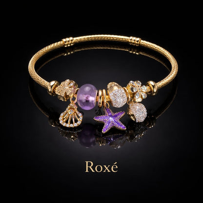 Bratara dama ROXE aurie cu charmuri marine stea de mare si scoica, eleganta