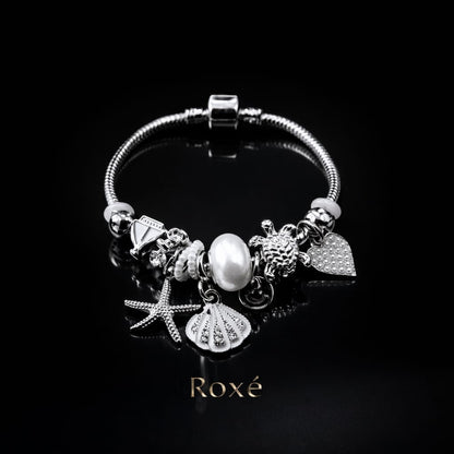Bratara ROXE argintie cu stea de mare scoica si testoasa charmuri elegante