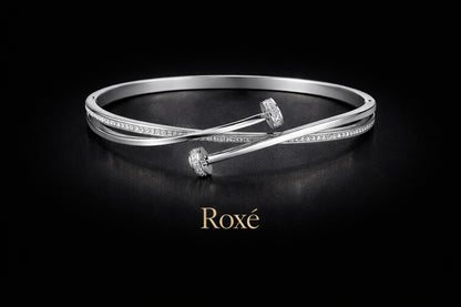 Bratara ROXE argintie eleganta cu design incrucisat si cristale inchizatoare fixa
