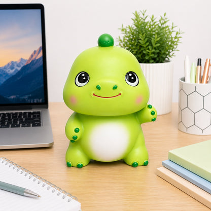 Pușculiță dinozaur verde 20 cm – cutie economii cu capac inferior, design vesel pentru copii