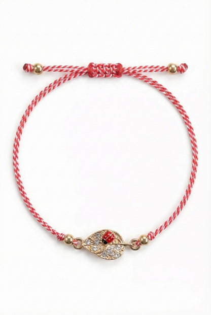 Set 12 bratari martisor cu frunza aurie cu strasuri si buburuza, snur rosu alb, ambalate individual