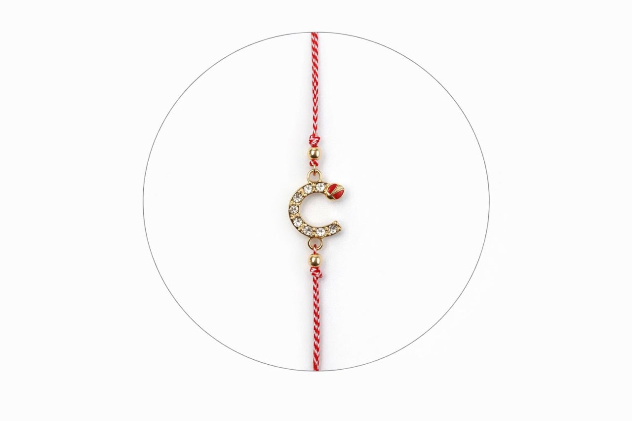Set 12 bratari martisor cu potcoava stilizata cu strasuri si buburuza, snur rosu alb