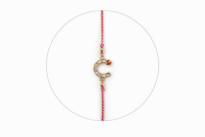 Set 12 bratari martisor cu potcoava stilizata cu strasuri si buburuza, snur rosu alb