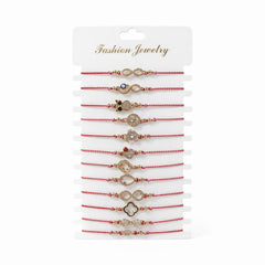 Set 12 Bratari Martisor cu Simboluri Protectie Aurii, Snur Rosu Reglabil, 20x11 cm