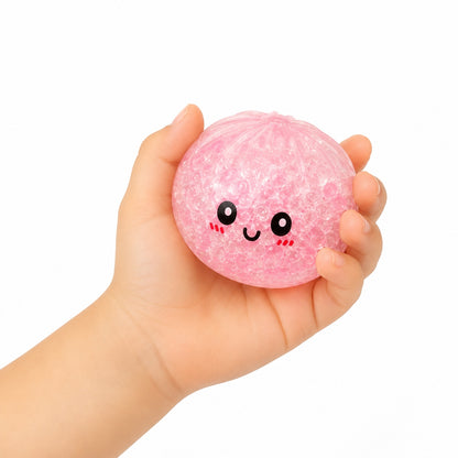 Squishy Dumpling cu Biluțe Gel 8,5 cm în Cutie Tip Bambus – Jucărie Antistres, Model Aleatoriu